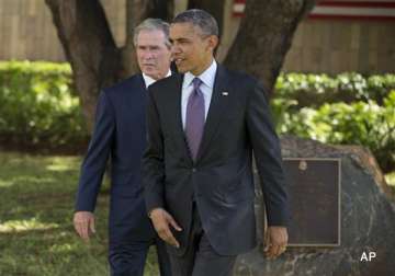 obama ends africa trip by joining bush at memorial