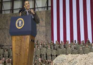 obama pays surprise visit to us troops pledges responsible end to afghanistan war