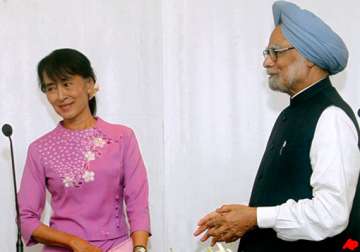 pm meets suu kyi invites her to visit india