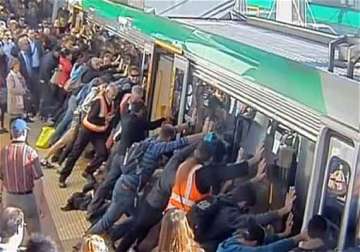 passengers tilt train in australia to free man trapped in the gap