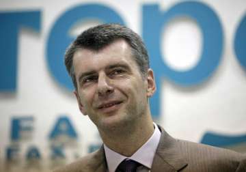 prokhorov russian tycoon to run against vladimir putin