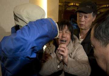 relatives sob after announcement on missing malaysia airlines plane