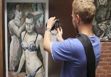russian police seize painting of putin in women s underwear