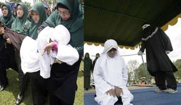 shariah police in indonesia gives 9 lashes to woman for extramarital affair