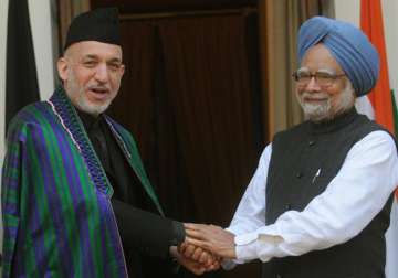 singh meets karzai hold talks with syrian prime minister