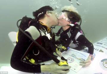 six scuba clad couples take underwater wedding vows in andaman sea