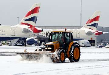some india bound flights cancelled amid uk snow chaos