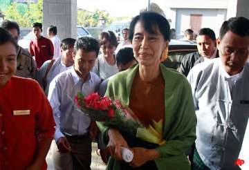 suu kyi registers party makes first parliament visit