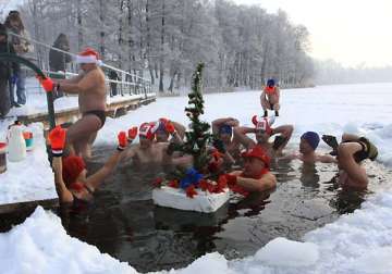 swimmers in poland take dip in freezing water
