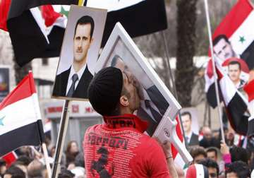 syria s assad makes rare appearance at rally