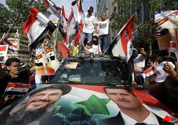 tens of thousands rally in syria against assad troops open fire
