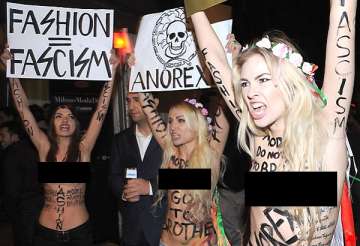 topless protesters crash milan fashion week in demo against anorexic models