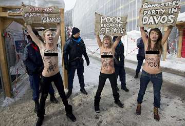 topless ukrainian women stage protest at world economic forum in davos