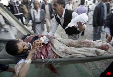 troops hit protesters marching into yemen capital