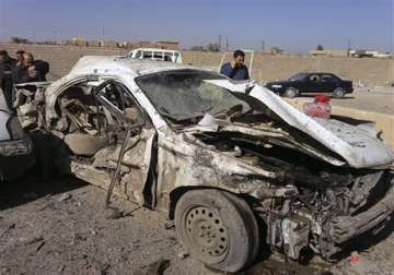 twin car bombs kill 11 in baghdad say police officials