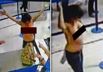 two women in uk stun passengers by stripping off at manchester airport watch video