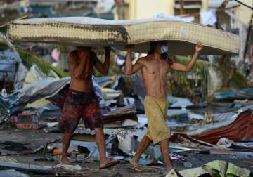 typhoon to drag philippine growth below 7 percent