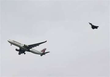 uk fighter jet escorts qatar plane to manchester airport