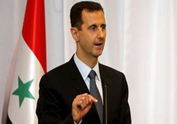 us uk back down from immediate strike assad vows victory