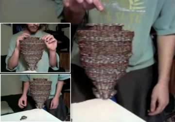 us man stacks 3 108 coins on a single dime
