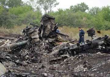 ukranian security officials say mh17 jet was hit by missile shrapnel