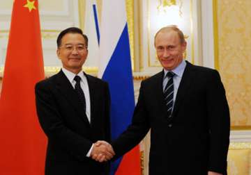 wary about us moves china russia pledge to prioritise ties