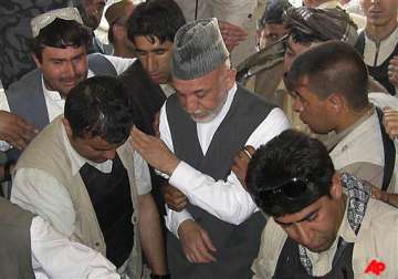 weeping afghan president buries his brother