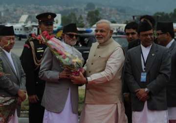 pm narendra modi arrives in nepal seeks new chapter in bilateral ties