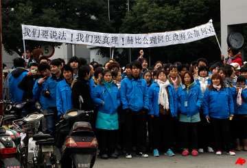 workers mass at shanghai factory in latest unrest