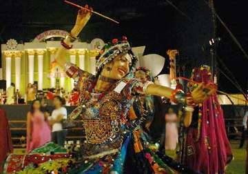 a look at how boys and girls perform dandiya during navratri