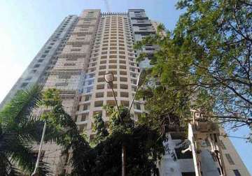 adarsh housing scam maharashtra govt rejects probe panel report