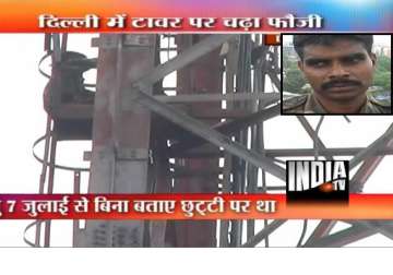 army deserter goes up delhi cellphone tower demands defence minister s presence