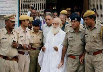 asaram bapu sent to 14 days in jail supporters create ruckus outside court