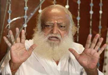 asaram bapu s supporters stop railway trains in thane
