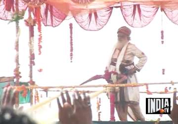 asaram bapu drenches his followers with colourful water