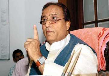 azam blames rss for up clashes