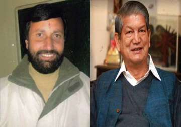 bjp demands action against uttarakhand cm for violating model code