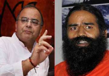 bjp wary as ramdev insists on banking transaction tax demonetization of high value currency notes