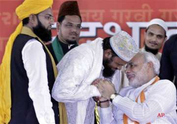 bjp leaders ask muslims to wear skull caps burqas to attend modi s fast