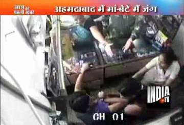 cctv footage of ahmedabad cellphone shop owner bashed up by his mother sister