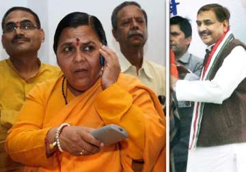 congress leader pramod tiwari threatens to reveal secrets about uma bharti