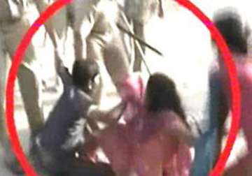 cop beats women protesting children s arrest in aligarh