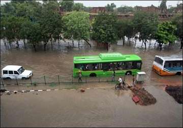 delhi crawls as heavy rain causes flooding