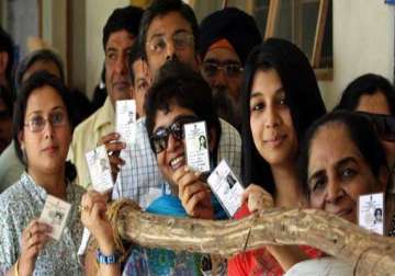 delhi witnesses record turnout in tight triangular contest