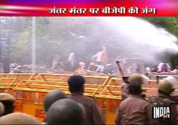 delhi police use teargas water cannons on bjp activists