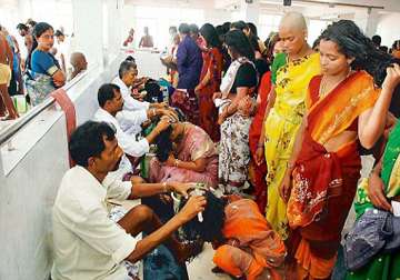 devotees donating hair at shirdi demand cheaper barber services