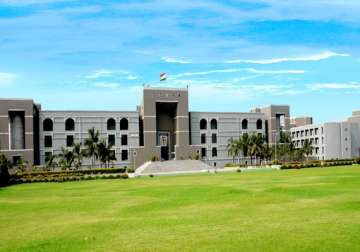 gujarat hc seeks state s reply on land allocation promise