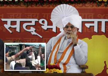 gujarat riot victims stage protest against modi detained