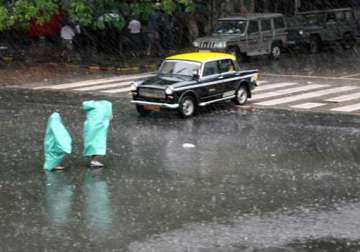heavy rains cripple life suburban train services in mumbai