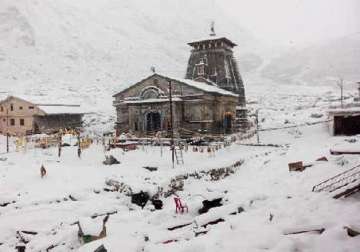 thick sheets of snow envelop famous himalayan temples in uttarakhand